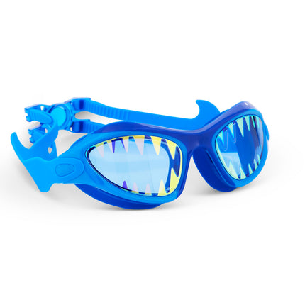 angled view of megamouth kids' swim goggles in riptide royal showing shark teeth screen printed on the lens on a blue wide frame