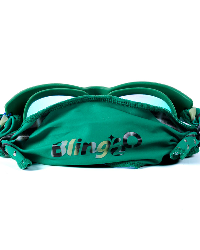 back shot of Softline Swim Goggles in meadow showing soft strap