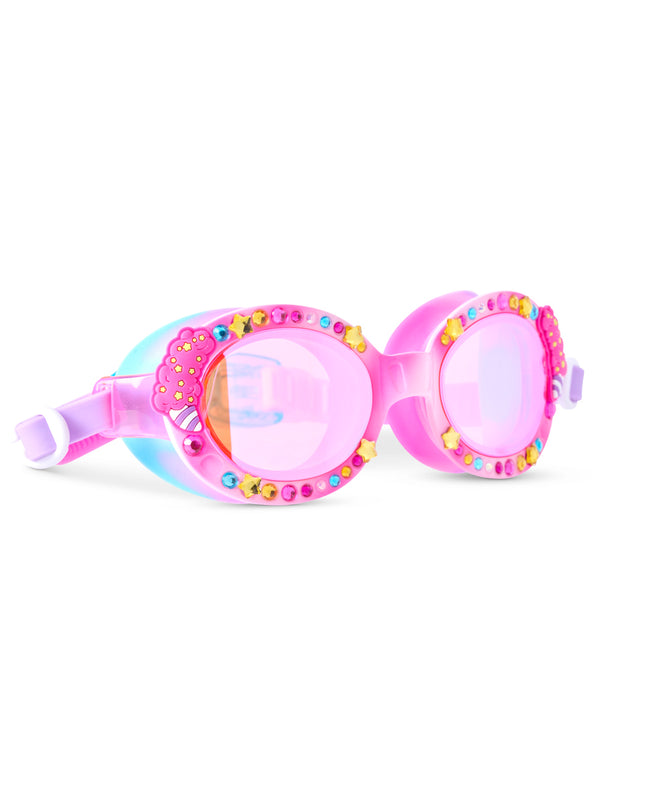 angled view of oval-shaped kids swim goggles in color pink parade featuring rhinestones, star gems, and cotton candy decals