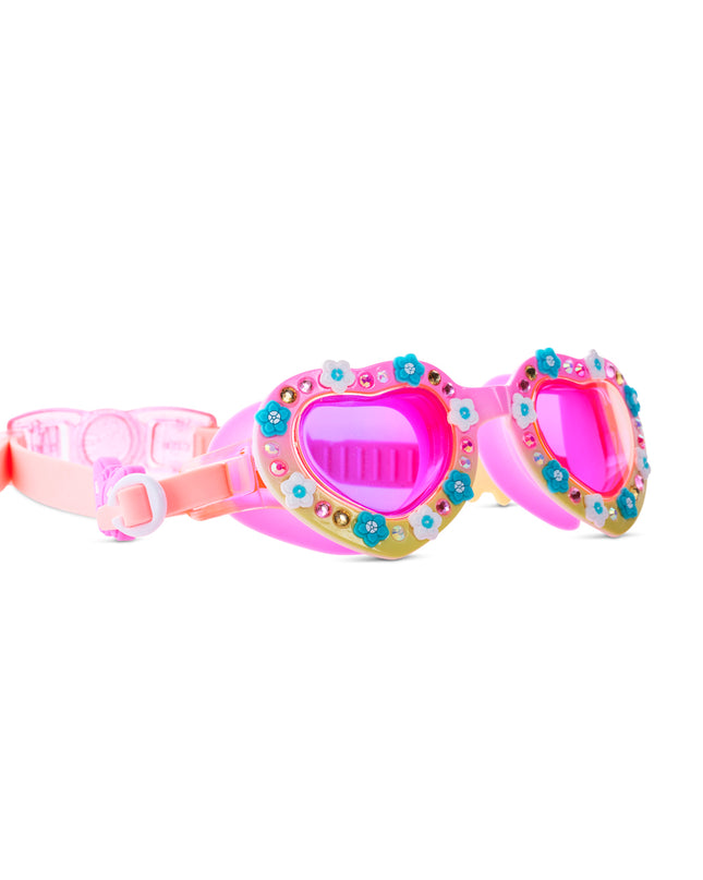 angled view of Daisies at Dawn kids swim goggles in sunkissed petals showing flower charms and rhinestones