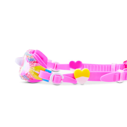 Close-up of Crystal Pop swim goggles in Candy Quartz showing crushed gems and heart sliders