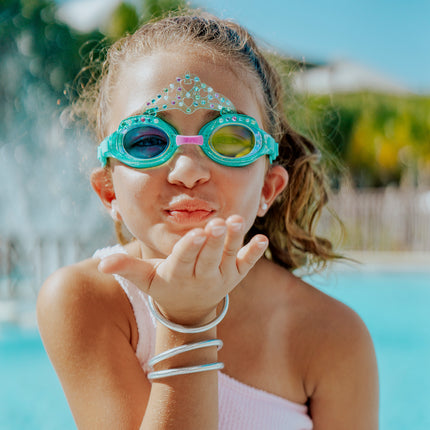 girl smiling posing wearing royal crown kids swim goggles in princess periwinkle showing crown and rhinestone details