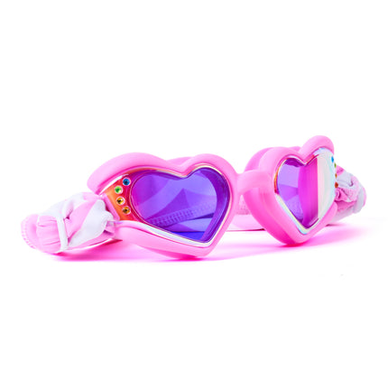 Angled view of Soft Crush Pink Wish swim goggles featuring glossy pink silicone heart frame, rhinestone details, mirrored lenses, and soft strap