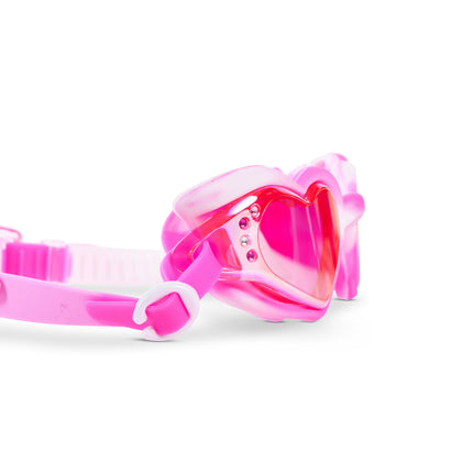 Close-up glam shot of Swirl Me Up Pink Drink goggles highlighting iridescent lenses and rhinestone details