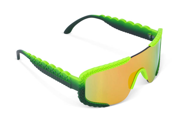 angled view of gulf shore kids' sunglasses in gator glare green showing gator textured arms and frame