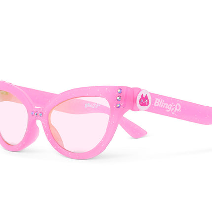 angled view of malibu beach kid's sunglasses in pisces pink to camera showing pink glitter frame and pink rhinestone detail