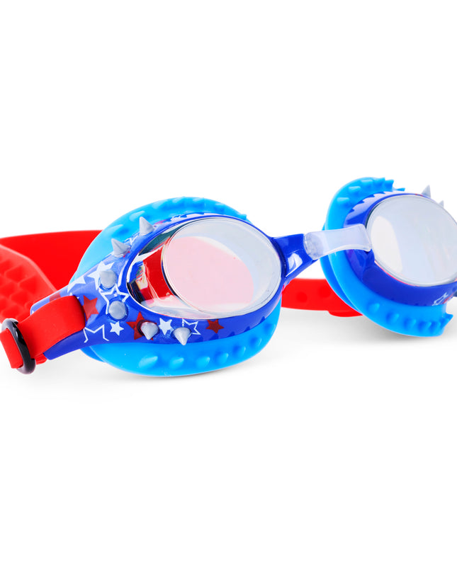angled view of prehistoric times kids' swim goggles in prehistoric and proud showing silicone spikes and stars printed on frame