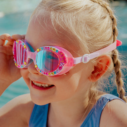 lifestyle image of girl smiling wearing candy carnival showing rhinestones and cotton candy detail