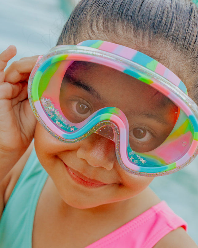 lifestyle of girl wearing crystal current in sapphire swirl showing turquoise glitter settled at the bottom of the frame