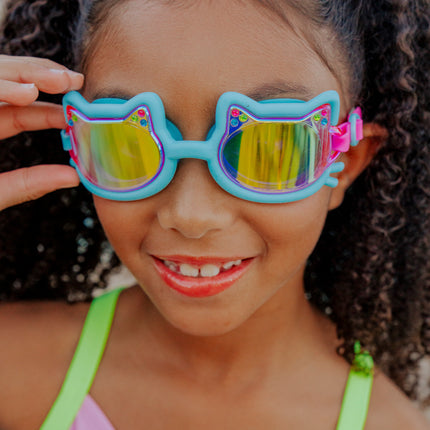 lifestyle of girl smiling wearing flexi feline blue all silicone swim goggles 