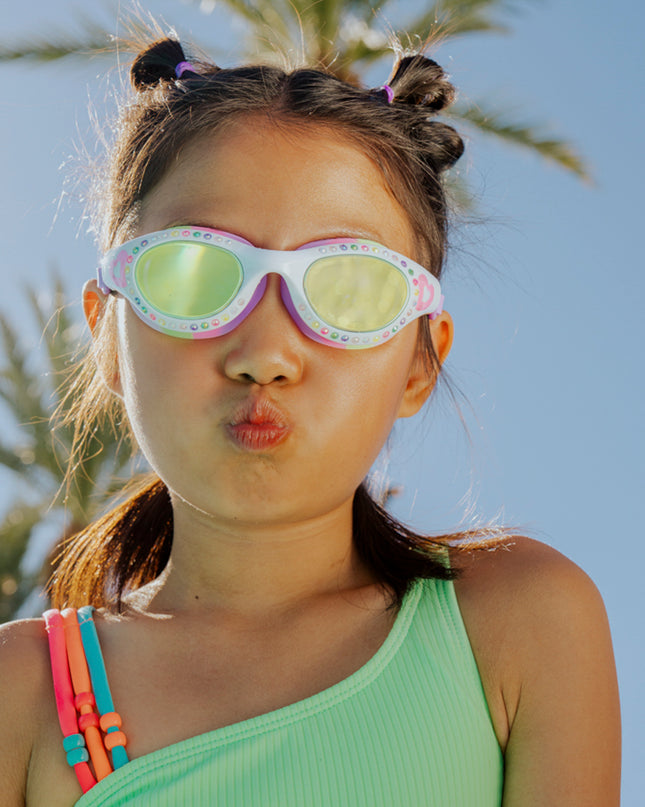lifestyle of girl making kissy face wearing love sparkles in passion purple showing rhinestones and bubblegum pink heart printed on the frame