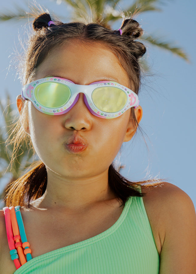 lifestyle of girl making kissy face wearing love sparkles in passion purple showing rhinestones and bubblegum pink heart printed on the frame