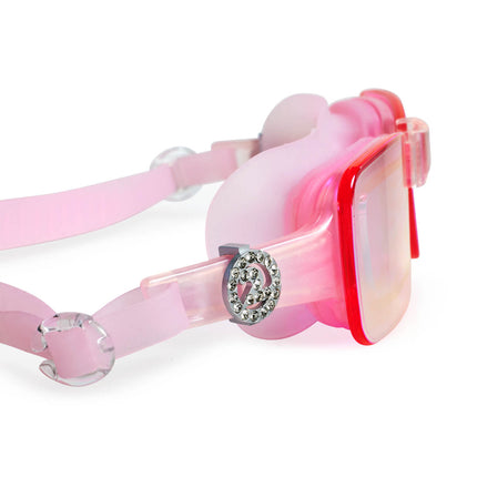 close-up view of vivacity swim goggles in blush pink showing sleek frameless goggles with mirrored lens and '2' rhinestone charm