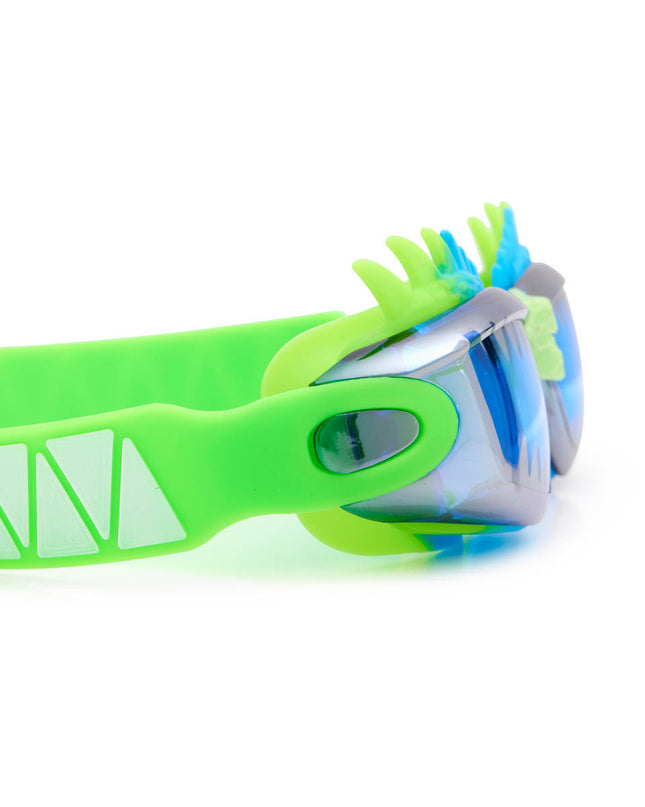 close-up view of draco the dragon kids' swim goggles in sea dragon green showing silicone spiked gasket and sharp teeth printed lens