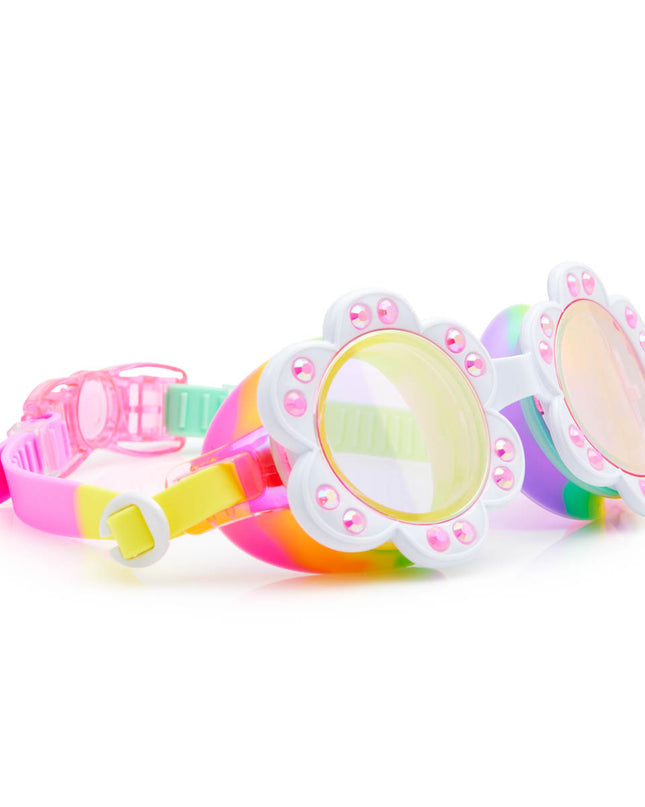 angled view of dandi flower shaped swim goggles in sunlit sherry showing petal detail with rhinestone and bright rainbow colored strap and gasket 