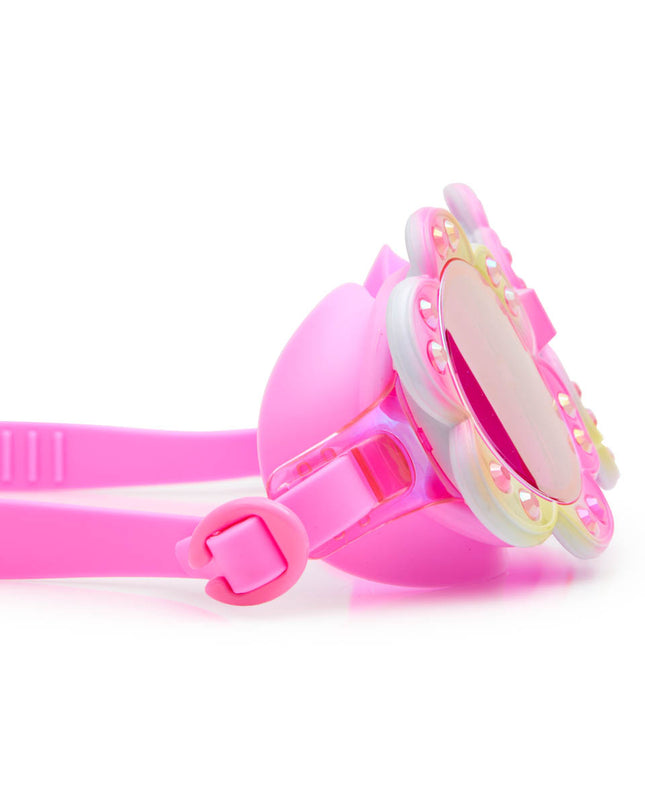 close-up view of gardenia flower shaped swim goggles in golden hour showing petal details and rhinestones with mirrored lens